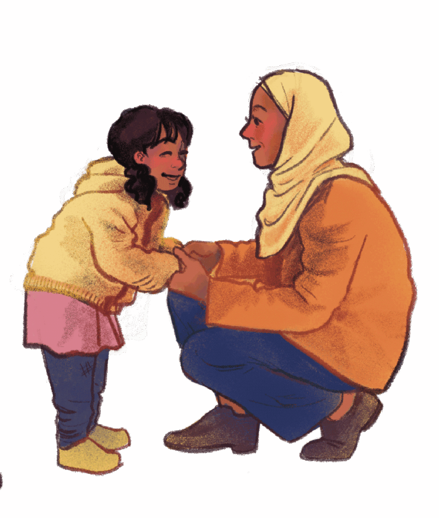 An adult wearing a headscarf and orange coat kneels, holding hands and smiling at a young girl in a yellow hoodie and pink dress.